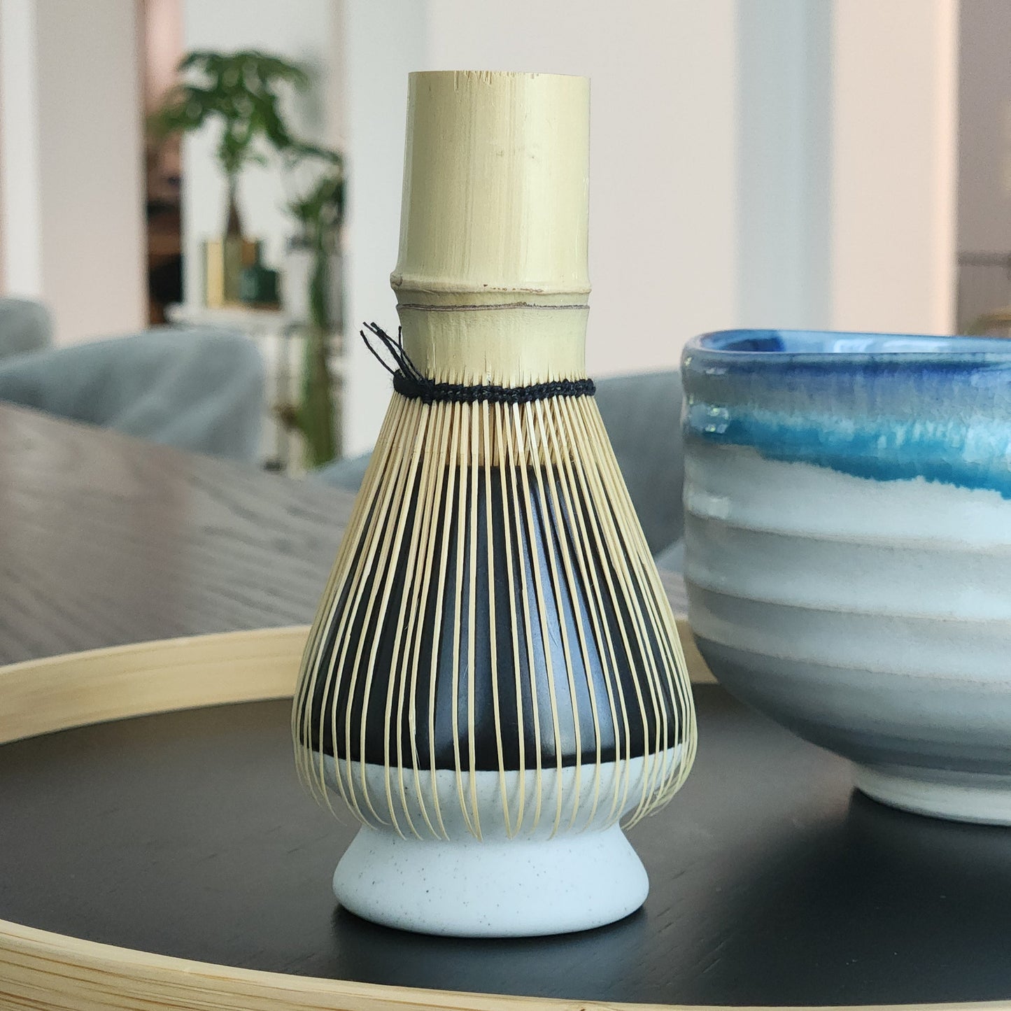 Close-up of a bamboo-style brush with a blurred background